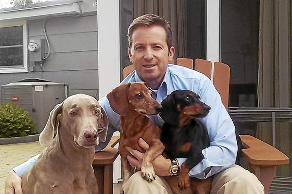 Rob with Dolly (Weimaraner), Franklin (red Dachshund) and Tyler (Black and Tan Dachshund).