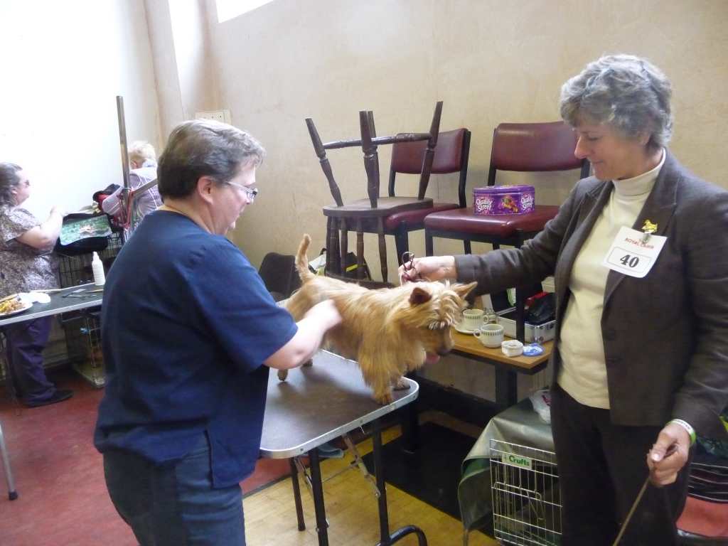 Sue Thompson gets a few pointers about rotating the coat.