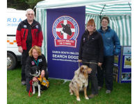 Bob Farnham, Caroline Moreton, Liz Beaumont and Kate Gilliver with two of the team dogs.