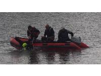 The Newfoundlands jump from a boat into the water and then tow the boat back to shore.