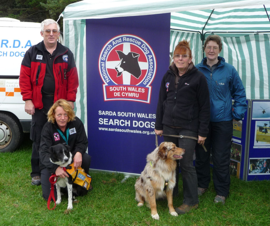 Bob Farnham, Caroline Moreton, Liz Beaumont and Kate Gilliver with two of the team dogs.
